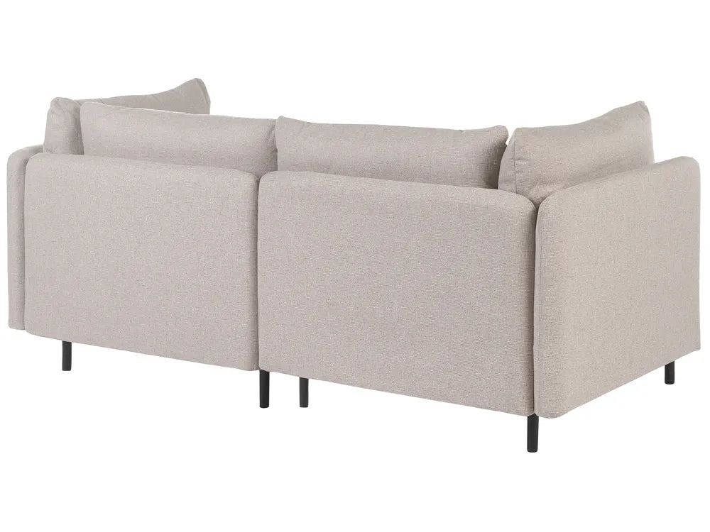 A light beige upholstered sectional sofa with two back cushions and two small black legs, shown on a plain white background.