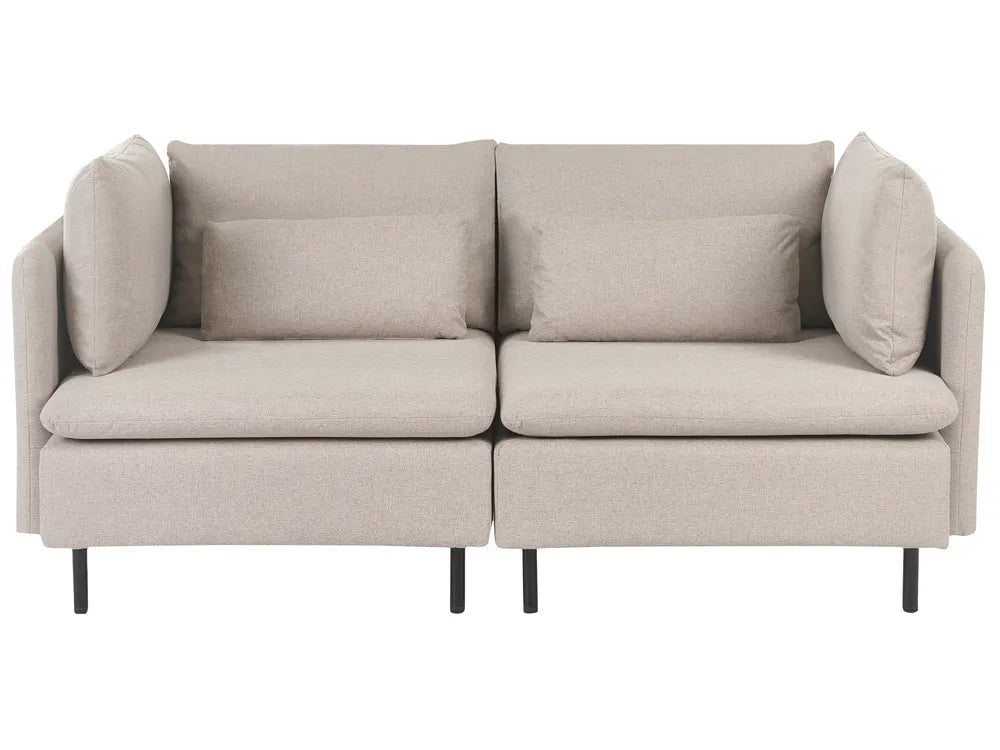 A modern two-seater sofa in a light beige textured fabric, featuring two matching throw pillows, a low profile, and slim black legs, shown against a plain white background.
