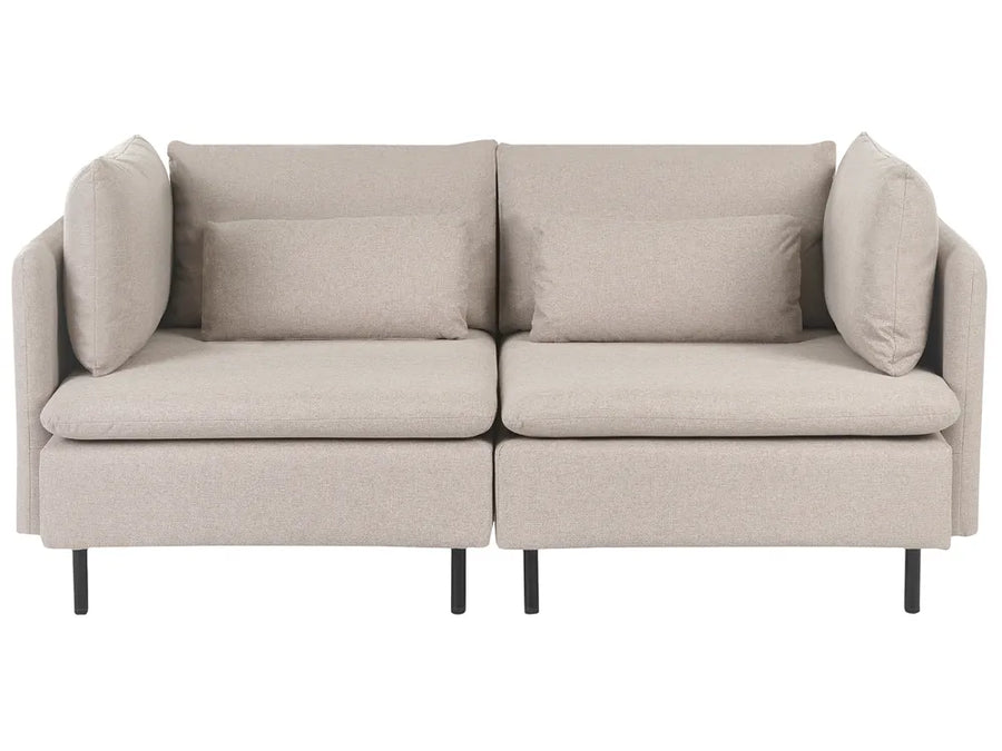 A modern two-seater sofa in a light beige textured fabric, featuring two matching throw pillows, a low profile, and slim black legs, shown against a plain white background.