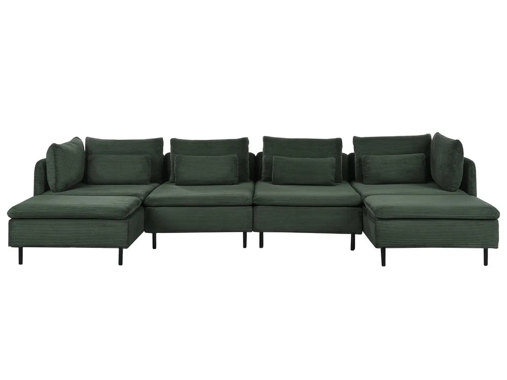A dark green modular sectional sofa with multiple back cushions and a chaise lounge on the left, shown against a plain white background.