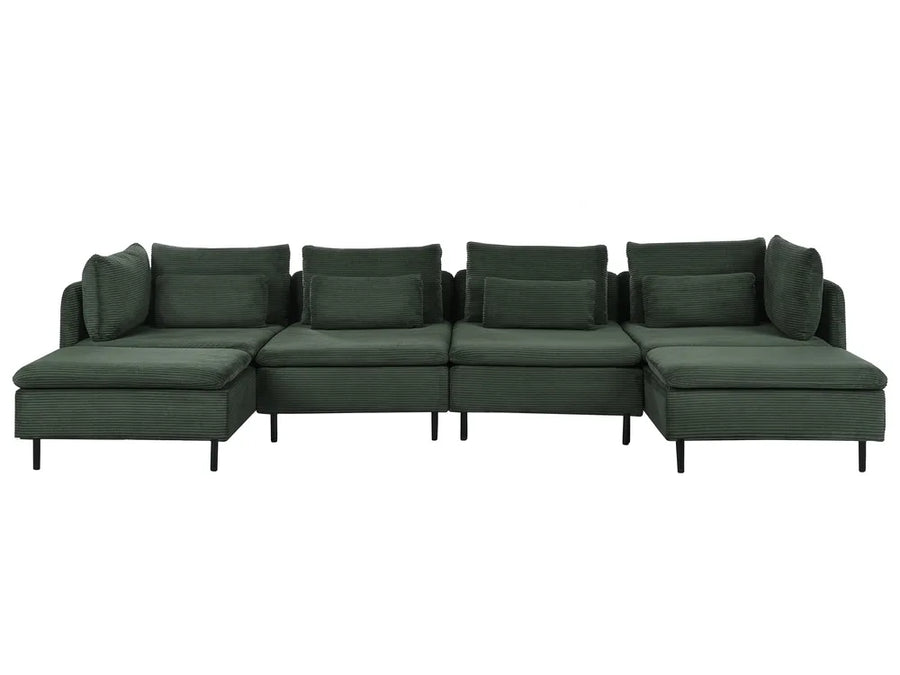 A dark green modular sectional sofa with multiple back cushions and a chaise lounge on the left, shown against a plain white background.