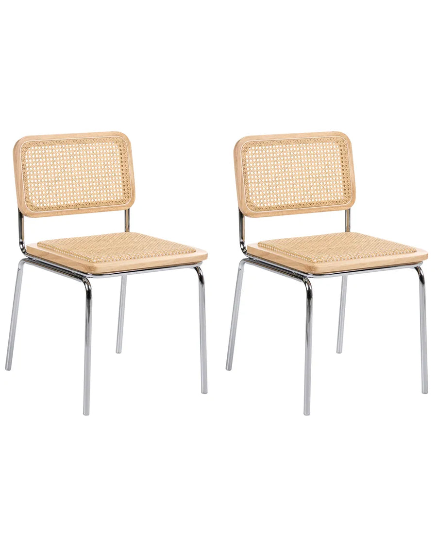 Two matching dining chairs with natural woven cane backrests and seats, supported by slim chrome metal legs, shown on a plain white background.
