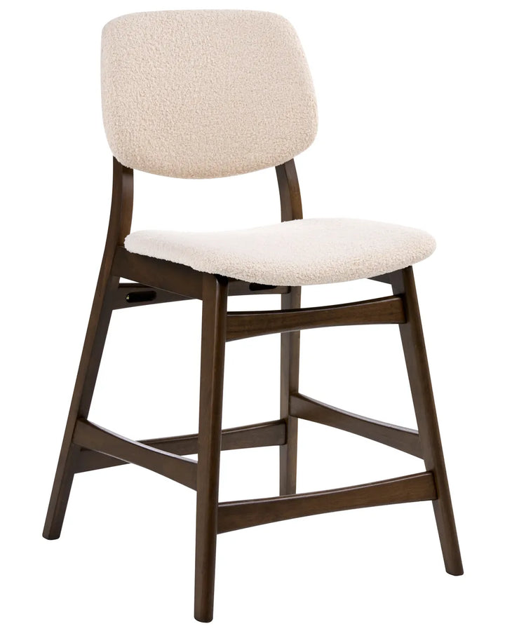 Bar stool with beige cushioned seat and backrest on a white background