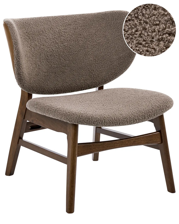 Brown upholstered chair with wooden legs on a white background