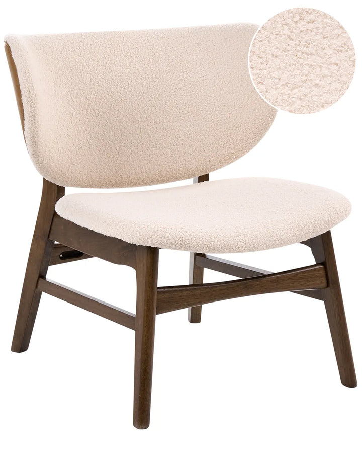 Beige armchair with wooden legs on a white background