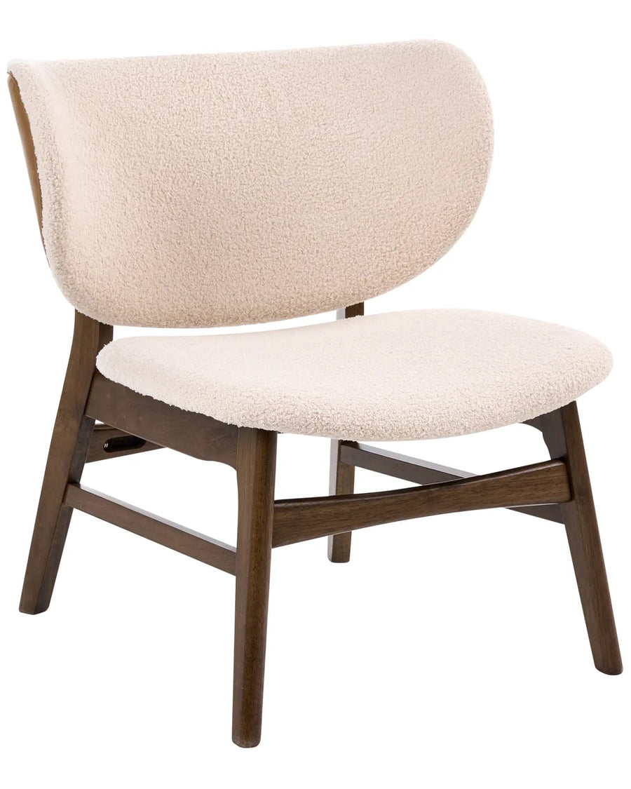 A modern accent chair featuring a curved, plush cream bouclé upholstered backrest and seat cushion, supported by a mid-century style dark brown wooden frame with angled legs.