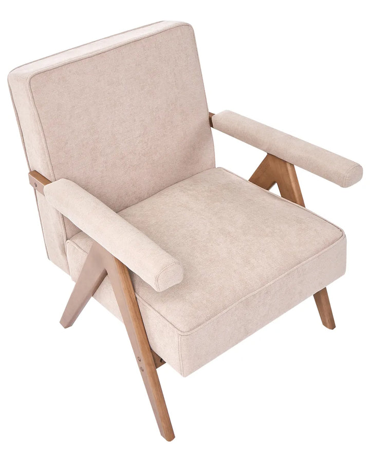 Beige armchair with wooden legs on a white background