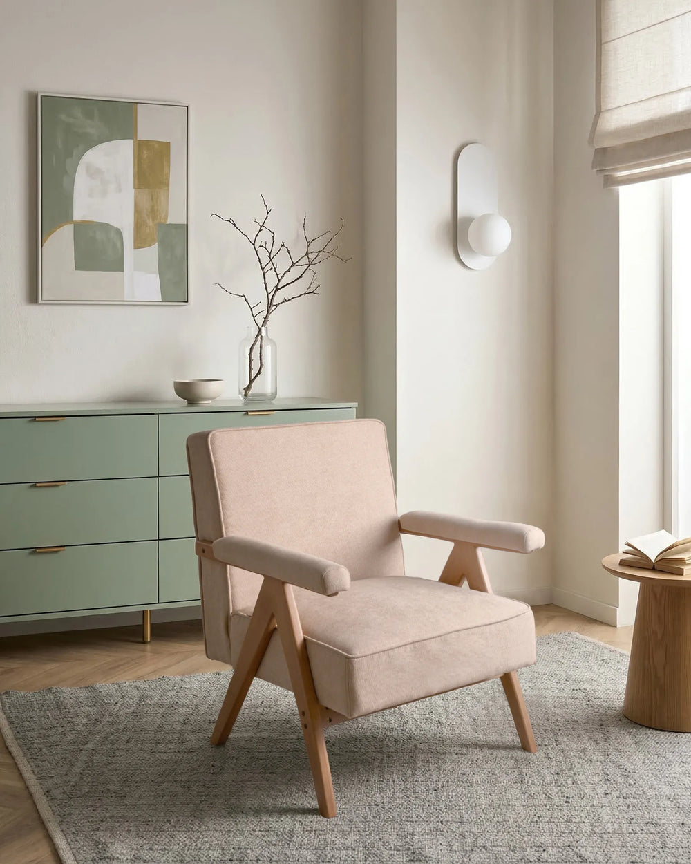 Beige armchair in a modern living room with a green cabinet and abstract art on the wall.