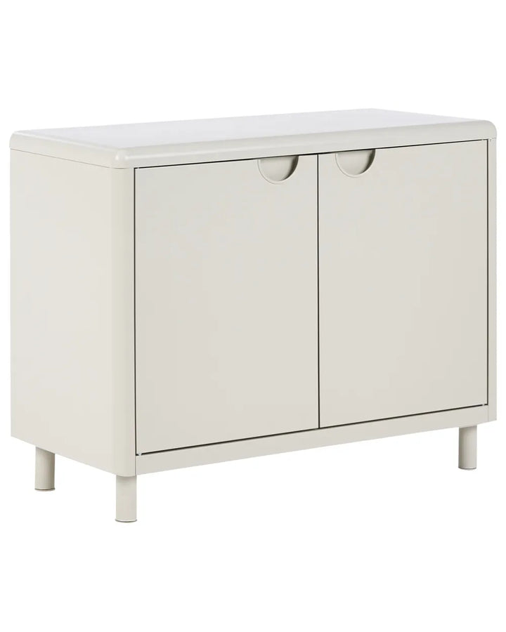 A modern two-door storage cabinet in a warm off-white finish, featuring minimalist circular pull handles and short legs, shown against a plain white background.