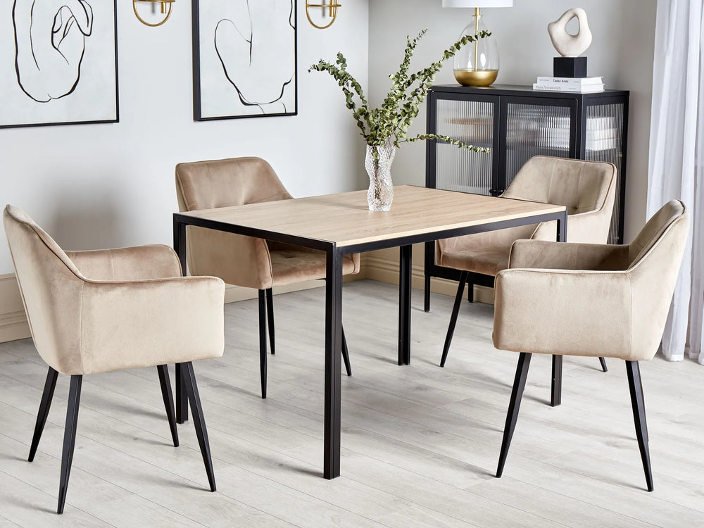 Dining room with a wooden table and beige chairs in a modern interior setting.