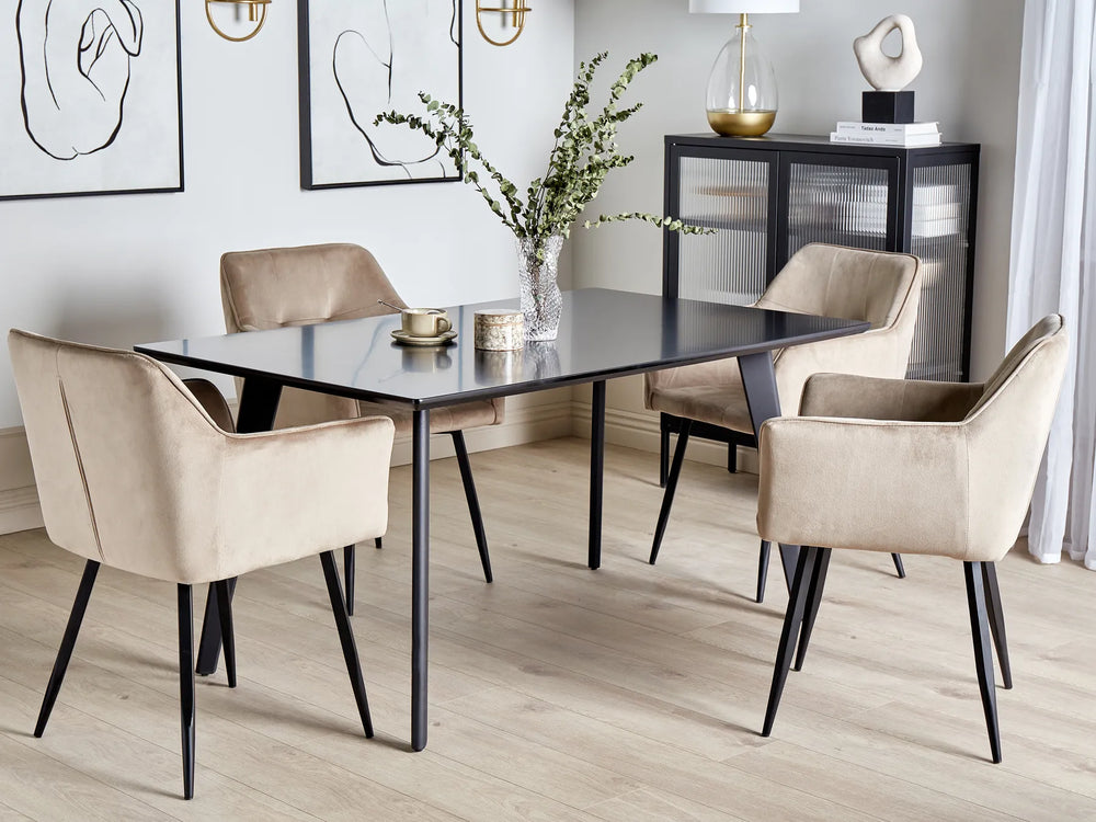 Dining room with a black table and beige chairs in a modern interior setting.