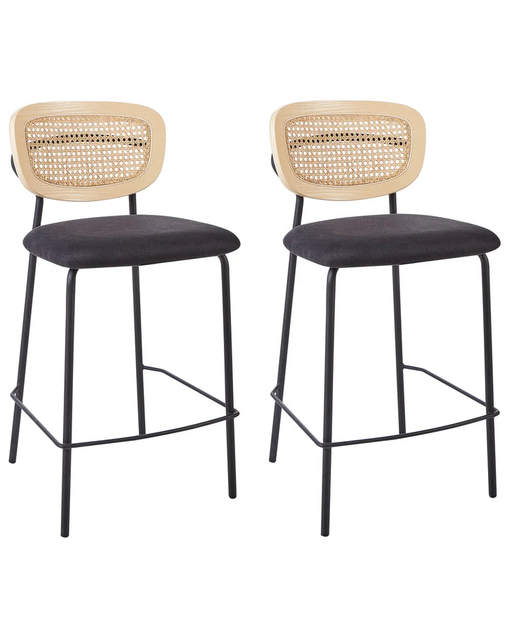 Two bar stools with wicker backrests and black seats on a white background