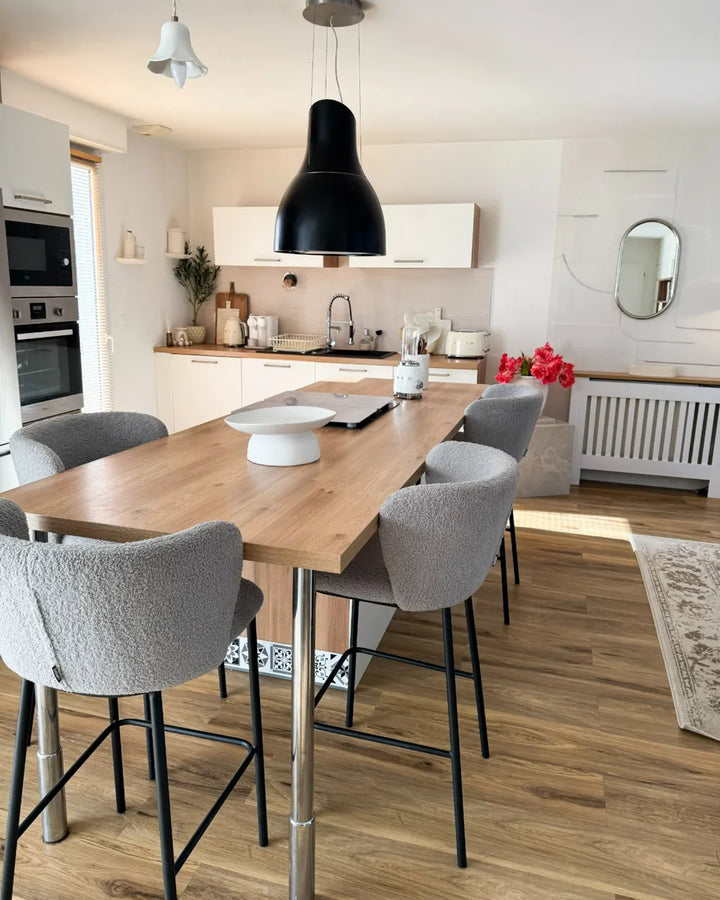 Modern kitchen with wooden dining table and gray chairs