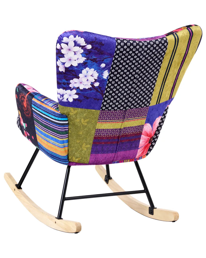 Colorful patchwork rocking chair with floral and geometric patterns on a white background
