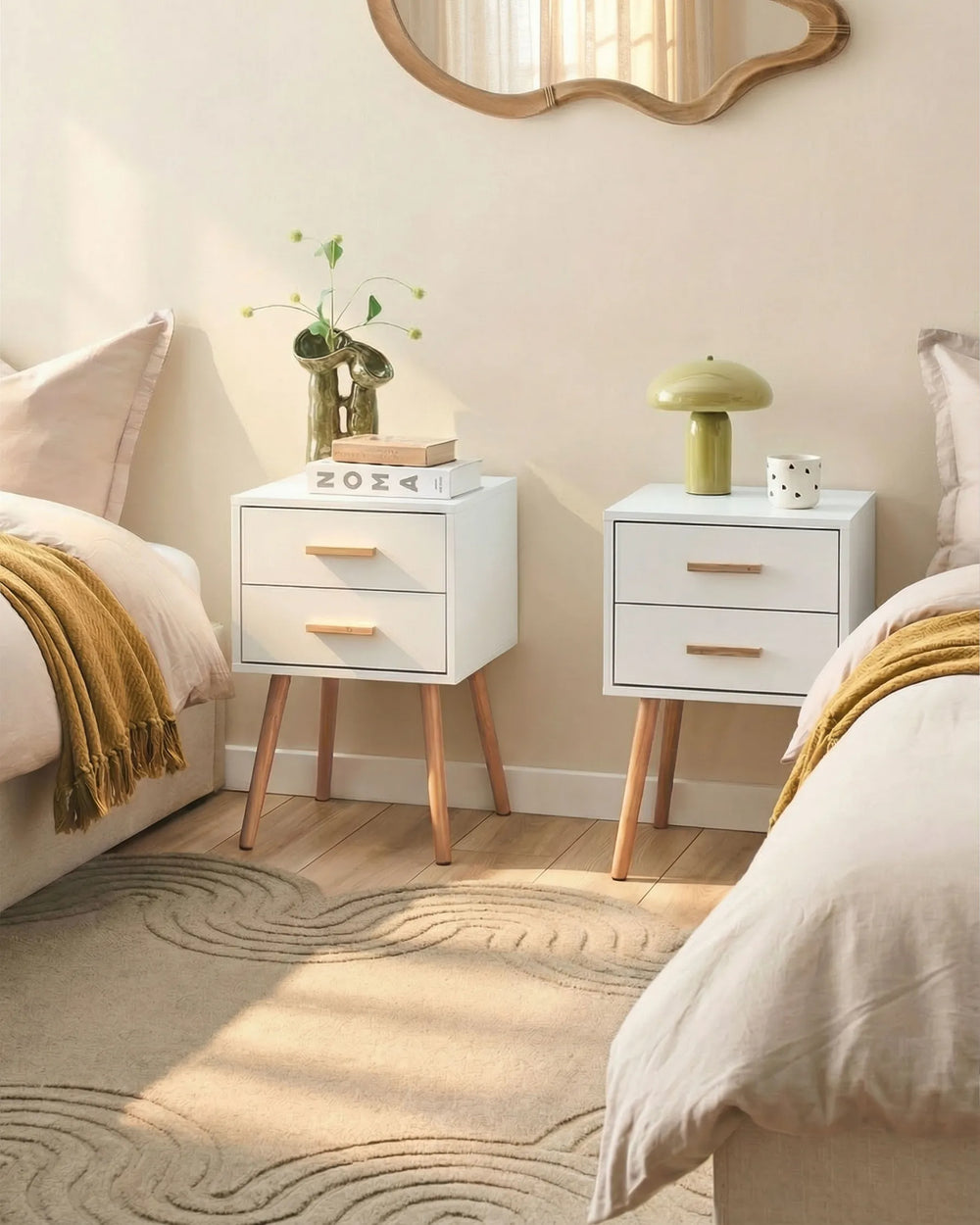 Two white nightstands with wooden legs in a bedroom setting.