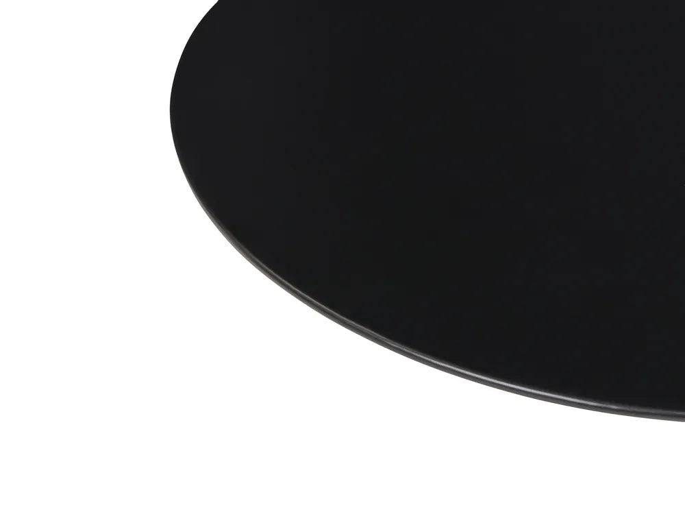 Close-up of a glossy black oval surface, likely a table top, on a plain white background.