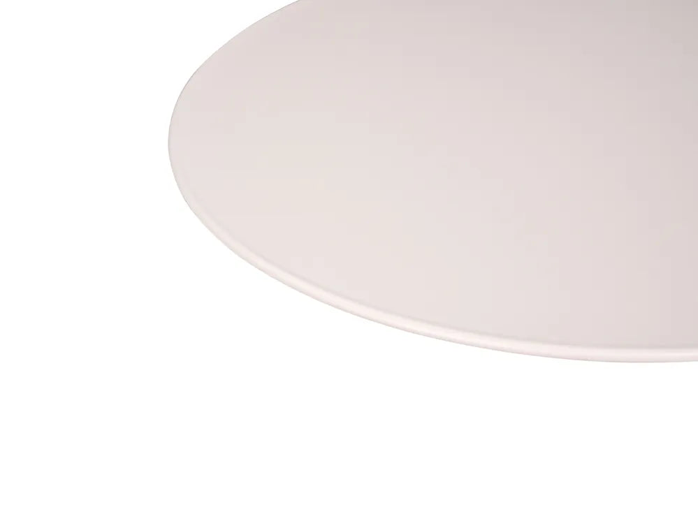 A close-up of a light beige or off-white oval surface, likely a tabletop or mat, shown against a solid white background.