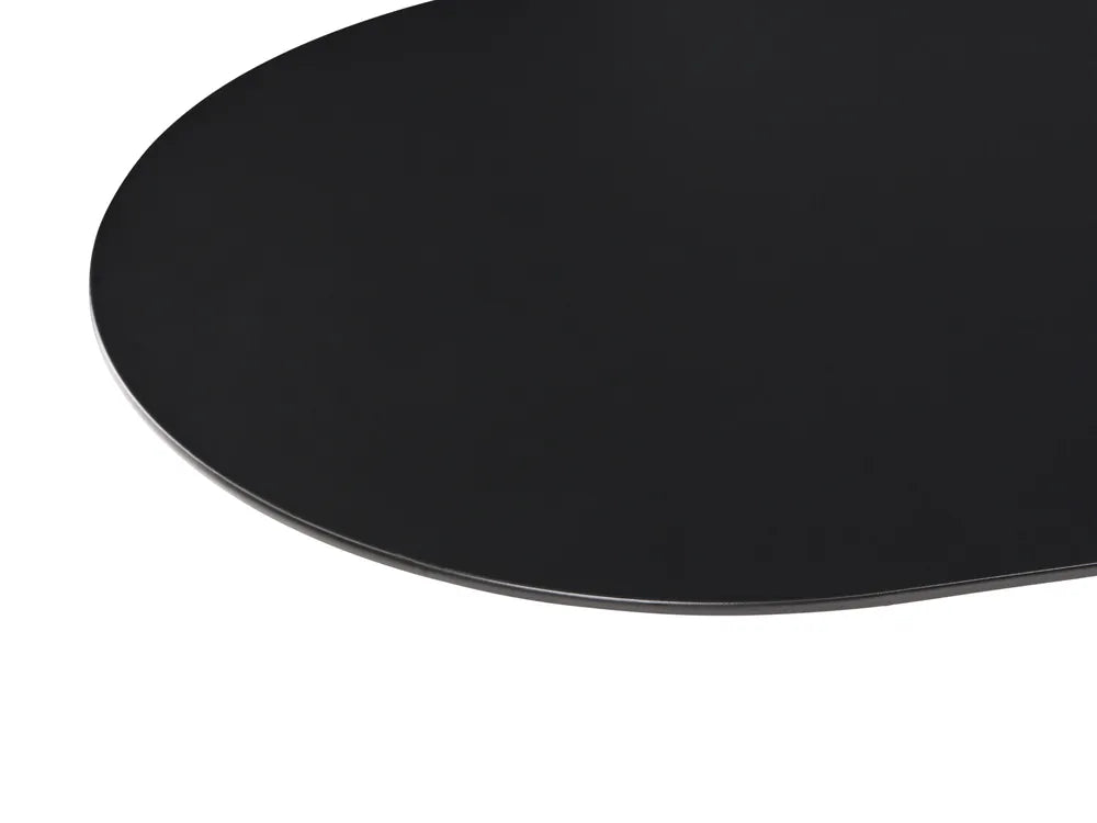 Close-up of a glossy black oval tabletop surface on a white background.