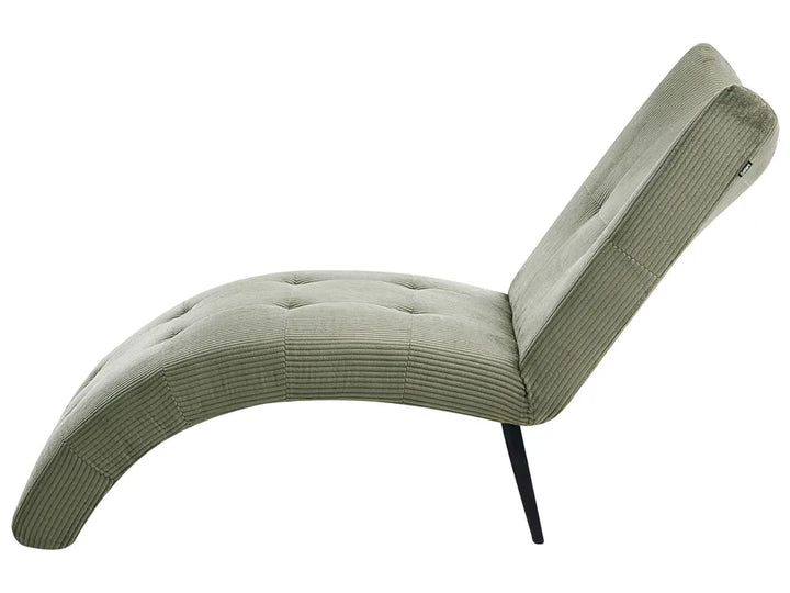 A modern curved lounge chair upholstered in a textured sage green corduroy fabric with a tufted seat and backrest, supported by slim black metal legs, shown against a plain white background.