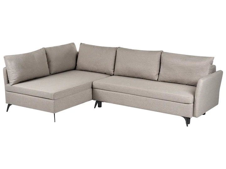 A light beige fabric sectional sofa with a left-facing chaise lounge, featuring four back cushions and four matching armrests, supported by slim black metal legs.