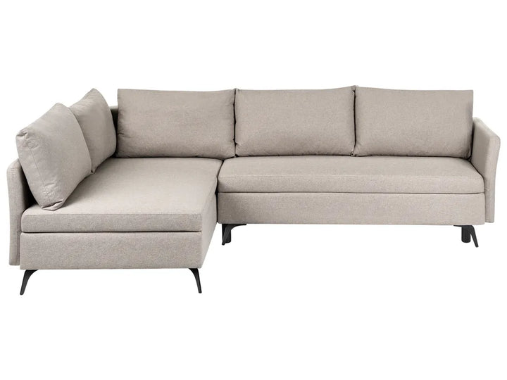 A light beige fabric sectional sofa with a left-facing chaise lounge, three back cushions, and slim black legs, shown against a plain white background.