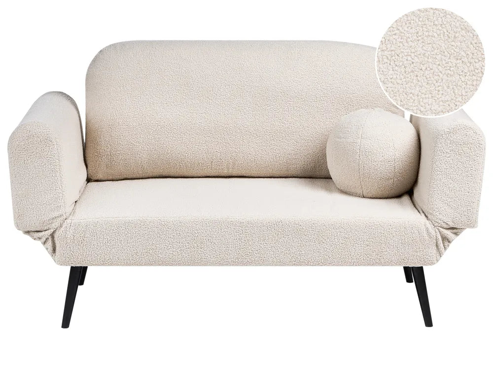 A cream bouclé loveseat sofa with a matching round throw pillow and black tapered legs, shown on a white background with a circular fabric texture zoom-in overlay in the top right.