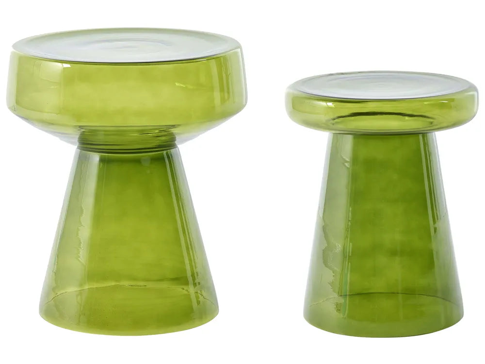 A pair of translucent olive green glass stools with wide round seats and tapered pedestal bases, shown on a plain white background.