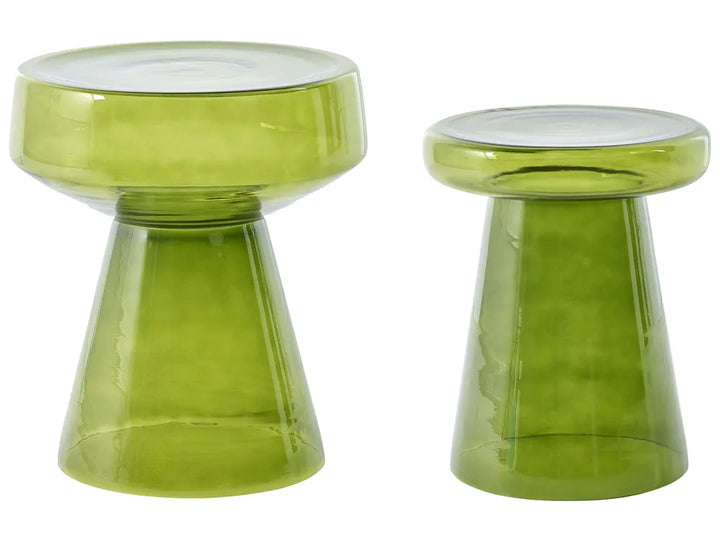 A pair of translucent olive green glass stools with wide round seats and tapered pedestal bases, shown on a plain white background.
