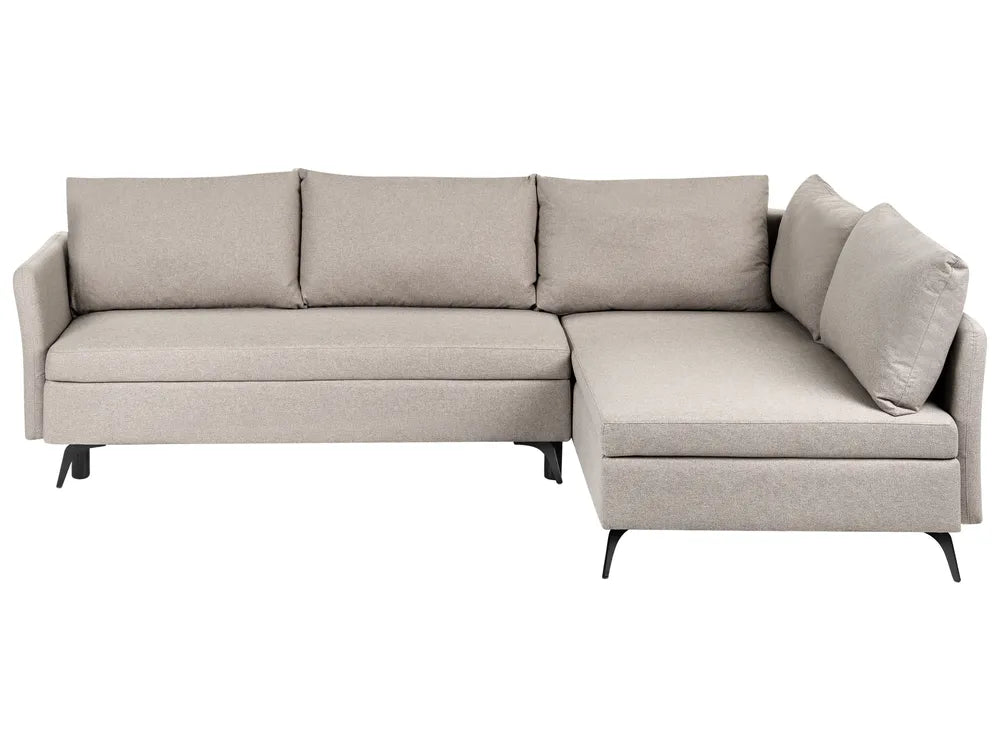 A light beige upholstered sectional sofa with a right-facing chaise lounge and three back cushions, shown against a plain white background.
