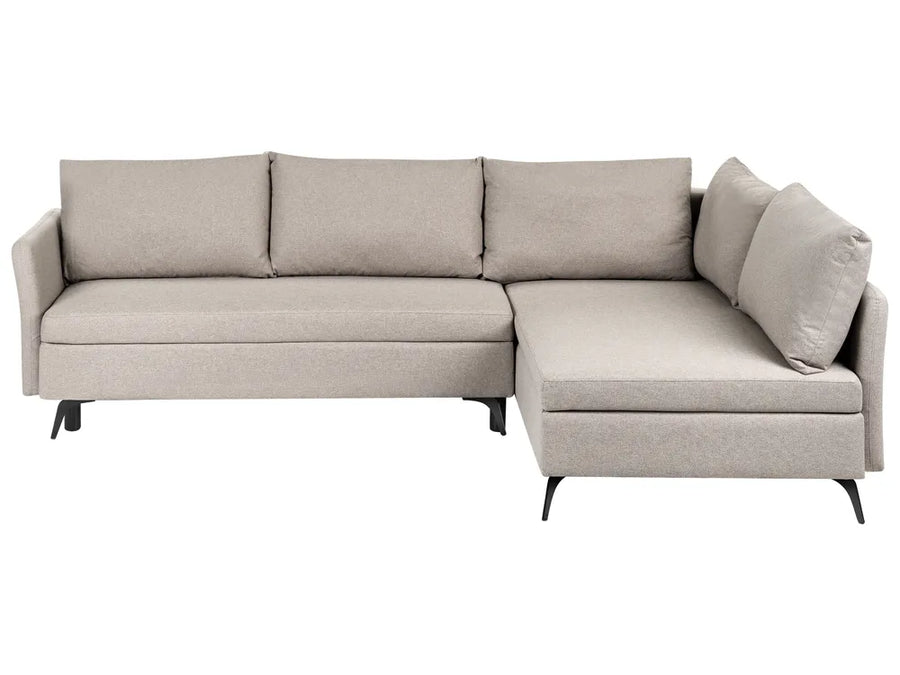 A light beige upholstered sectional sofa with a right-facing chaise lounge and three back cushions, shown against a plain white background.