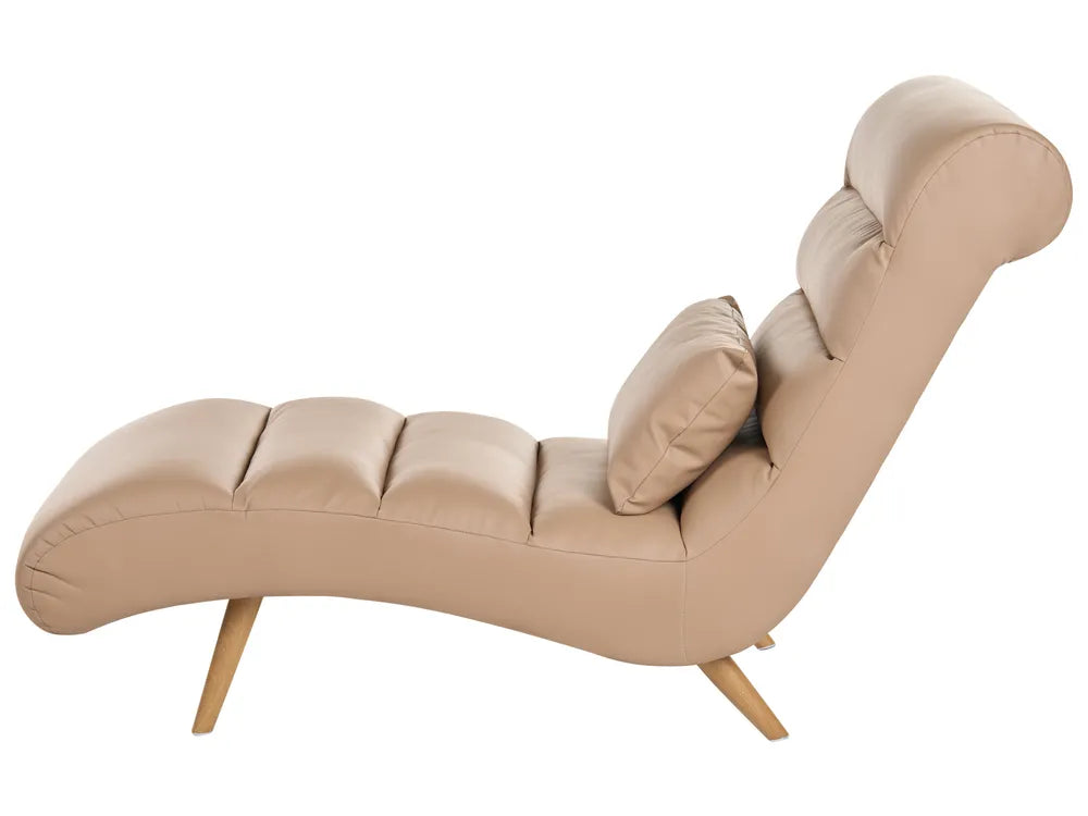 A modern chaise lounge chair upholstered in light beige faux leather with a matching lumbar pillow and light wood legs, shown against a plain white background.