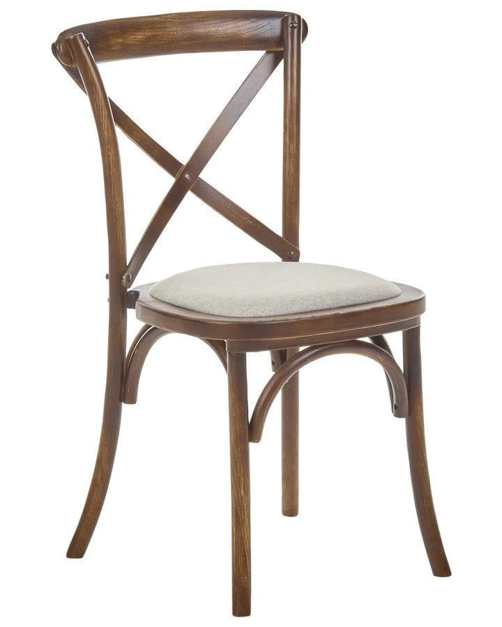 A wooden dining chair with a curved backrest, crossed X-back design, and a light beige upholstered seat cushion, shown against a plain white background.