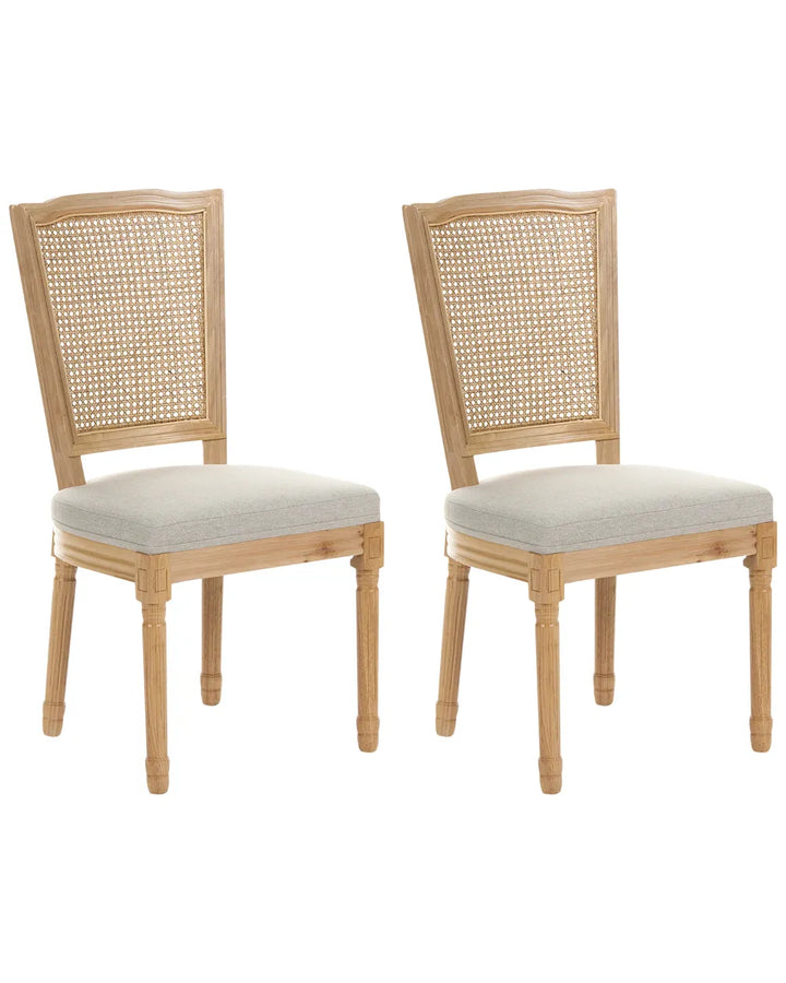 Two matching wooden dining chairs with woven cane backrests and light gray upholstered seats, shown on a plain white background.