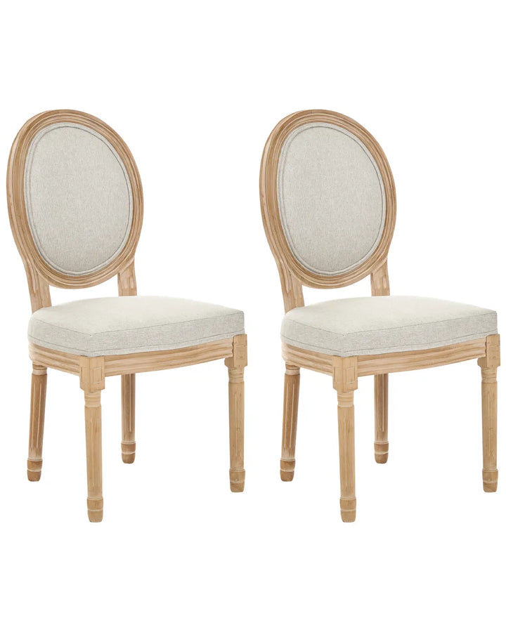 Two matching dining chairs with oval upholstered backs and light natural wood frames, shown on a plain white background.