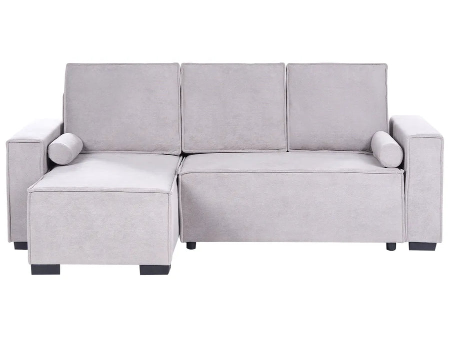 A light gray upholstered sectional sofa with a left-facing chaise lounge, three back cushions, cylindrical armrests, and small dark feet, shown on a plain white background.