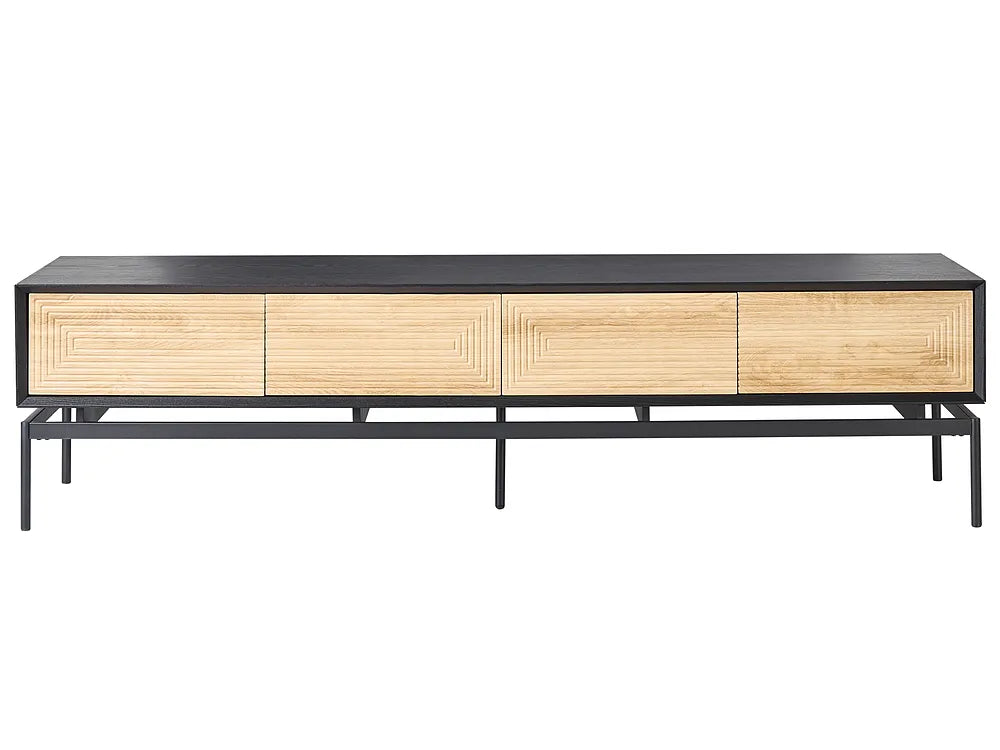 A modern media console with a black metal frame and top, featuring four light natural wood drawers with geometric reeded panel designs, set against a plain white background.