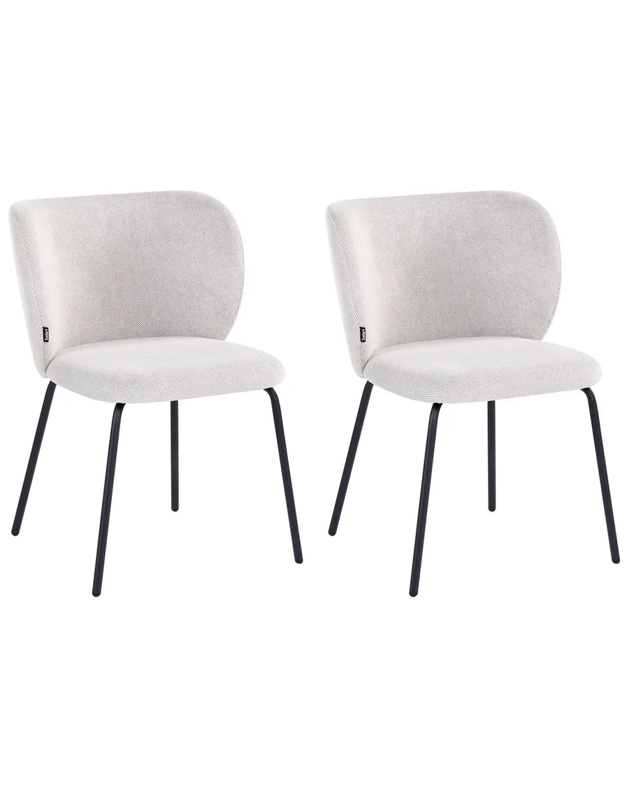 Two modern dining chairs with light beige textured fabric upholstery and slim black metal legs, shown side by side on a white background.