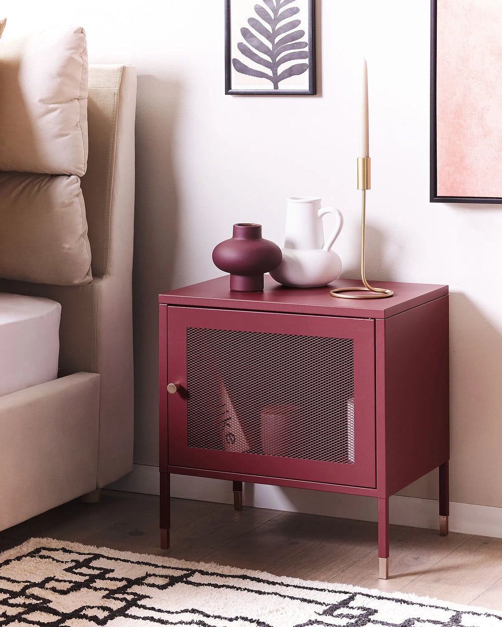 Maroon side table with decorative items in a living room setting
