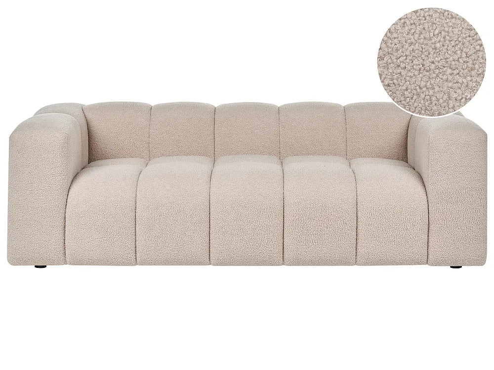 A modern beige bouclé sofa with a segmented, tufted backrest and wide armrests, shown against a plain white background with a circular fabric texture inset in the top right.