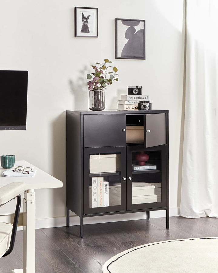 Dark wooden cabinet with glass doors in a room with a TV and decor items.