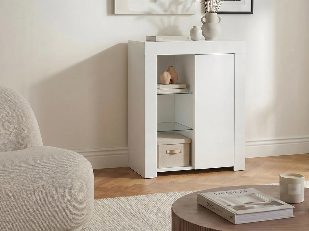 White cabinet in a living room with a neutral color scheme