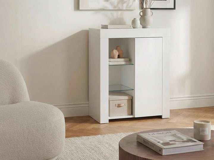 White cabinet in a living room with a neutral color scheme