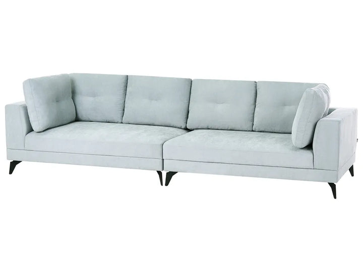 A modern three-seater sofa upholstered in a pale icy blue fabric, featuring tufted back cushions, angled armrests, and slim black legs, shown against a plain white background.