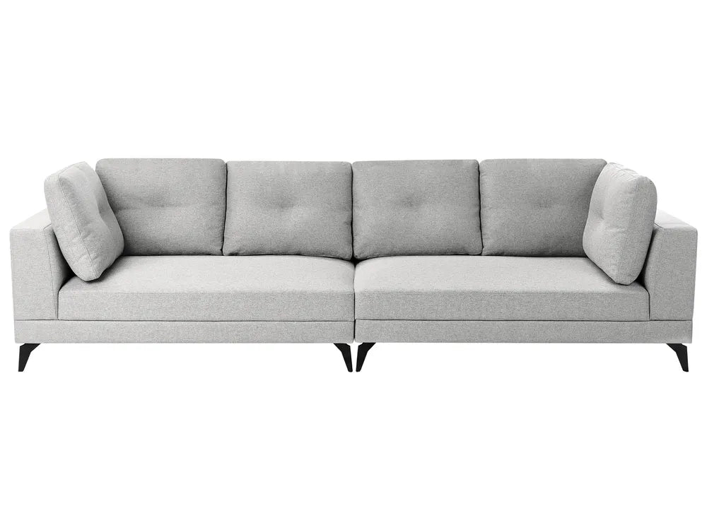 A modern light gray fabric three-seater sofa with tufted back cushions, matching square back cushions on the arms, and short black legs, shown against a plain white background.