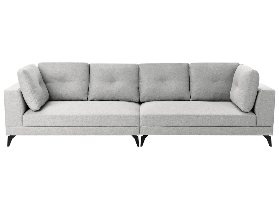 A modern light gray fabric three-seater sofa with tufted back cushions, matching square back cushions on the arms, and short black legs, shown against a plain white background.
