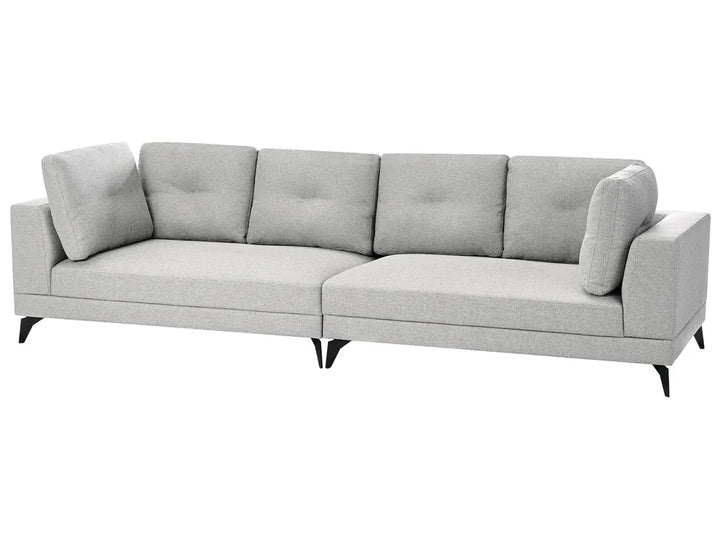 A modern three-seater sofa upholstered in light gray fabric with tufted back cushions, angled armrests, and tapered black legs, shown against a plain white background.