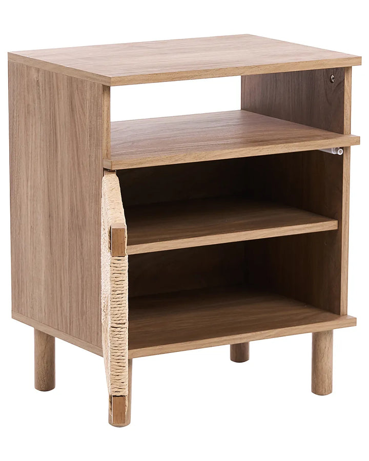 A small wooden side table or cabinet with a natural oak finish, featuring three open shelves and a hinged door on the front left side, shown against a plain white background.