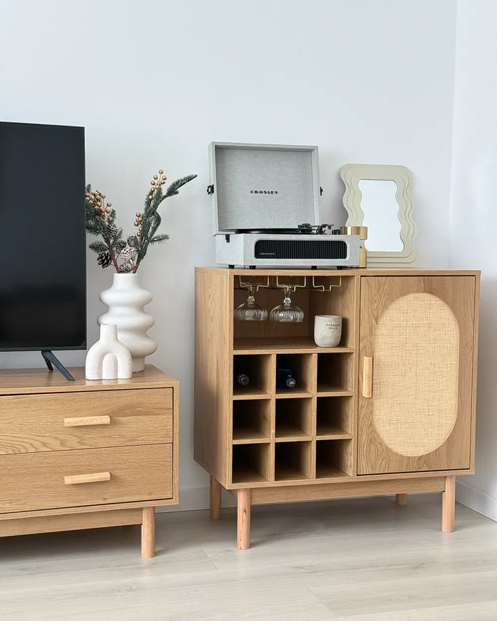 A light oak wood bar cabinet