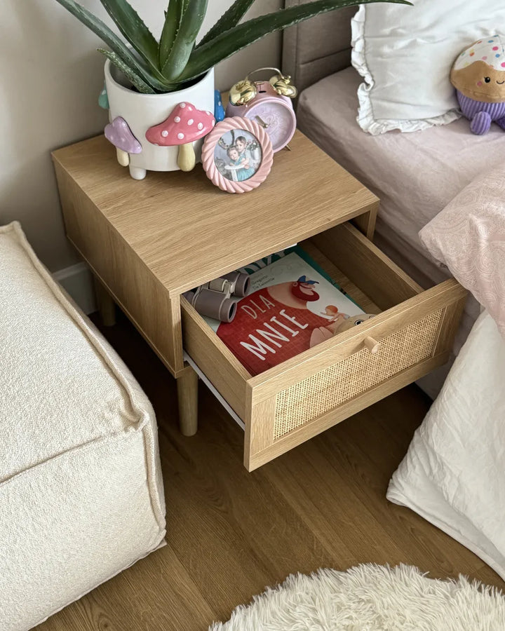 A light oak wood side table with a single drawer