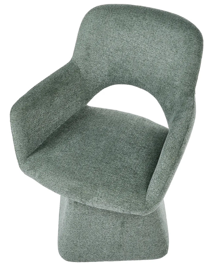 A modern upholstered accent chair in a textured sage green fabric, featuring a curved backrest, integrated armrests, and a sculptural pedestal base, shown against a plain white background.